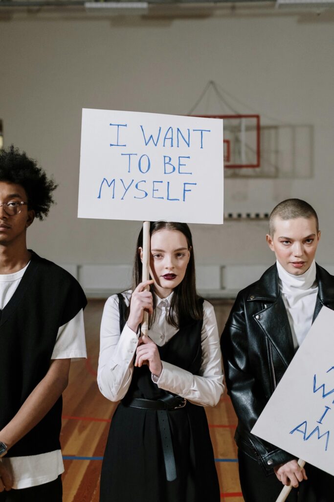 Group holding signs for self-identity